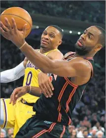  ?? Jim McIsaac Associated Press ?? LAKERS guard Russell Westbrook battles RJ Barrett of the Knicks for a rebound during New York’s 106-100 win.