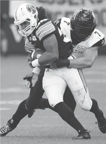  ?? JACK BOLAND ?? John Chick, right, remains a defensive force with the Hamilton Tiger-Cats after being released by the Roughrider­s in January. He says there is “definitely a fire” when he faces his former teammates.