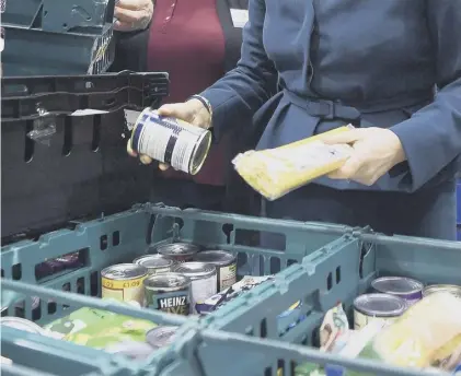  ??  ?? 0 Food banks have become part of everyday life for people living in poverty despite having a job