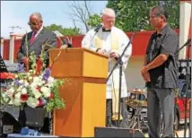  ?? CHRIS BARBER — DIGITAL FIRST MEDIA ?? Father Chris Rogers of St. Patrick Church delivers a blessing for the new firetruck.