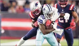  ?? Steven Senne / Associated Press ?? Cowboys wide receiver CeeDee Lamb (88) tries to break free from Patriots free safety Devin McCourty on Sunday.