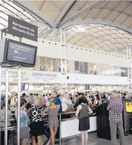  ??  ?? Busy security check area at the terminal's departure area