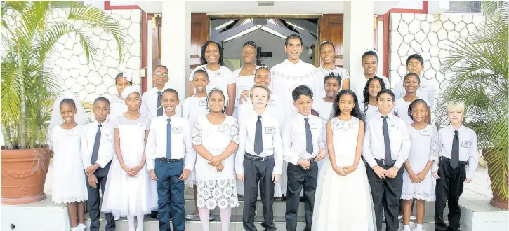  ?? Contribute­d ?? First Holy Communion Class of 2019 at Stella Maris Church on The Feast of Corpus Christi, Sunday, June 23, with Rev Fr Howard Thompson, pastor.