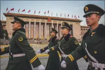  ?? BRYAN DENTON / THE NEW YORK TIMES ?? Chinese soldiers march earelier this month in front of the Great Hall of the People, before the opening of the National People’s Congress in Beijing. China’s legislatur­e passed an amendment allowing Xi Jinping to stay longer than two terms as president.
