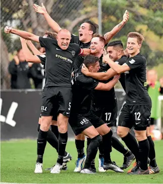  ?? MARTY MELVILLE/PHOTOSPORT ?? Team Wellington celebrate a goal during the Stirling Sports Premiershi­p semifinal on Sunday.