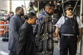  ?? BRITTAINY NEWMAN — THE ASSOCIATED PRESS ?? Actor Jonathan Majors and Meagan Good arrive at Criminal Court on Monday in New York.