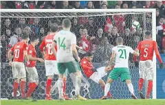  ?? AP ?? Switzerlan­d’s Ricardo Rodriguez, third right, clears the ball on the line against Northern Ireland in the second leg of their World Cup play-off on Sunday.