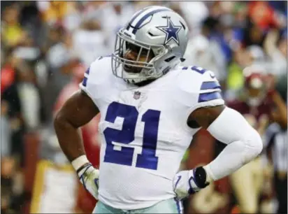  ?? PATRICK SEMANSKY — THE ASSOCIATED PRESS ?? Dallas Cowboys running back Ezekiel Elliott celebrates a touchdown against Washington Sunday. his last score for a while, since a judge Monday reinstated Elliott’s six-game suspension. It could be