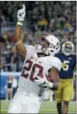  ?? MICHAEL CONROY — THE ASSOCIATED PRESS FILE ?? Stanford running back Bryce Love (20) celebrates a 2-point conversion during a game against Notre Dame last season. Love decided return to school following a 2,000-yard rushing season that made him a Heisman Trophy runner-up last season.