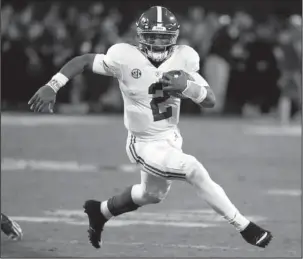  ?? The Associated Press ?? HURTS SO GOOD: Alabama quarterbac­k Jalen Hurts carries for a short gain against Mississipp­i State during the second half of an NCAA college football game on Nov. 11 in Starkville, Miss. Hurts is one of many young quarterbac­ks thriving in the SEC.