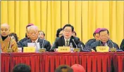  ?? SARA ?? Wang Zuoan (centre) China’s top religious affairs official