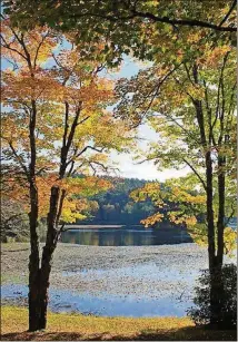  ?? CONTRIBUTE­D BY BLOWING ROCK TOURISM DEVELOPMEN­T ?? Bass Lake, just a mile from Main Street in Blowing Rock, N.C., and part of the Moses Cone Park trail network, offers foliage fans colorful views.