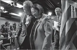  ?? [JACQUELYN MARTIN/THE ASSOCIATED PRESS] ?? Senate Minority Leader Chuck Schumer of New York hugs Sen. Mazie Hirono, D-hawaii, as they leave a news conference Thursday in Washington where they spoke about the immigratio­n crisis.