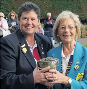  ??  ?? Champion Lorraine Clark of Victoria Bowling Club collects her prize