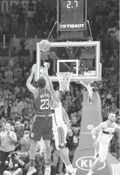  ?? MARK J. TERRILL/ASSOCIATED PRESS ?? Clippers guard Lou Williams, left, hits the game-winning 3-point shot as Wizards guard Bradley Beal defends late in the second half on Saturday.