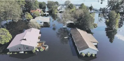 ?? Picture: AFP ?? HARBINGER. Homes are submerged in the aftermath of hurricane Florence in Lumberton, North Carolina, on Wednesday. The death toll from the storm stands at more than 36 in three states.