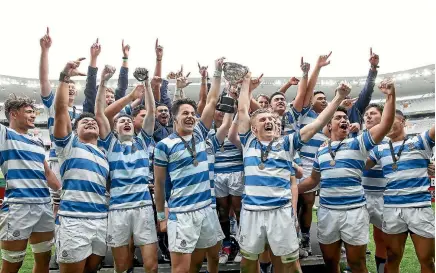  ?? PHOTO: GETTY IMAGES ?? Delighted St Kentigern players celebrate after winning the first XV final between against Sacred Heart last year.