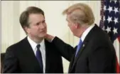  ?? EVAN VUCCI — THE ASSOCIATED PRESS ?? President Donald Trump greets Judge Brett Kavanaugh his Supreme Court nominee, in the East Room of the White House, Monday in Washington.