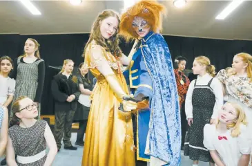  ??  ?? Above right: Leads Abbey Peterson (Beauty) and Gabrielle Rota (Beast) stand amongst the cast in Warragul Youth Theatre’s production of “Beauty and the Beast”.