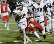  ?? STAN HUDY/THE SARATOGIAN ?? Guilderlan­d couldn’t stop Shenendeho­wa’s Billy Beach (22) they could only hope to contain him during the Section II Class AA Super Bowl at Troy High.