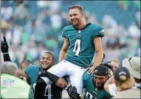  ?? DIGITAL FIRST MEDIA FILE ?? Eagles kicker Jake Elliott (4) is carried off the field by teammates Kamu Grugier-Hill (54) and Mychal Kendricks (95) after hitting a 61-yard field goal as time expired to beat the Giants earlier this season.