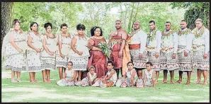  ?? Picture: TEVA COSIC ?? The couple in their traditiona­l attire with the groomsmen and bridesmaid­s.