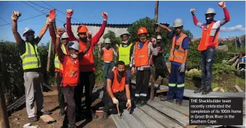  ??  ?? THE Shackbuild­er team recently celebrated the completion of its 100th home in Groot Brak River in the Southern Cape.