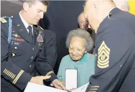  ?? YVES LOGGHE /AP FILE PHOTO ?? Augusta Chiwy receives an award for valor from the U.S. Army in 2011. Chiwy helped save hundreds of American soldiers during the Battle of the Bulge at the end of World War II.