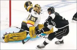  ?? Mark J. Terrill Associated Press ?? JEFF CARTER puts the puck past Golden Knights goalie Marc-Andre Fleury in the Kings’ first win over Vegas this season in a matinee game at Staples Center.