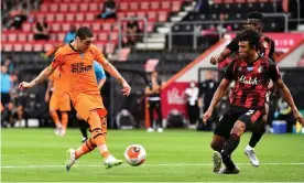  ?? Photograph: Glyn Kirk/NMC Pool/PA Images ?? Newcastle’s Miguel Almirón strokes home his side’s third goal against Bournemout­h.