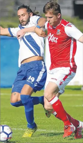  ?? Picture: Gary Browne FM4907305 Buy this picture from kentonline.co.uk ?? Whitstable’s Ash Brown holds off Bearsted’s Ignicio Garcia Fernandez