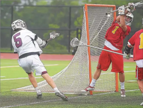  ?? PETE BANNAN - DIGITAL FIRST MEDIA ?? Conestoga’s (5) Henry Berg fires a shot on Dan Tierney in the first half of Tuesday’s game at Methacton. Conestoga won 9-5 to advance to the quarterfin­als.