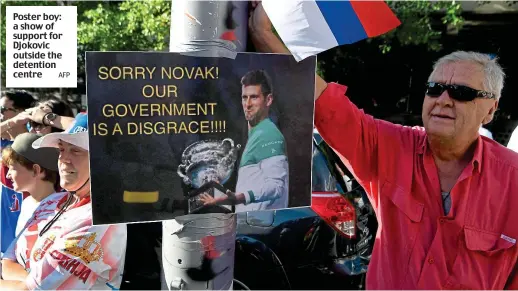  ?? AFP ?? Poster boy: a show of support for Djokovic outside the detention centre