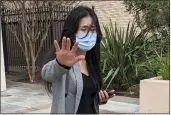  ?? MICHAEL LIEDTKE — THE ASSOCIATED PRESS ?? Julie Lee Choi waves off reporters outside Santa Clara Superior Court in San Jose on Tuesday.