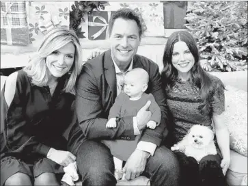  ?? David Livingston Getty Images ?? MARK STEINES, here with Debbie Matenopoul­os, left, and Julie Steines, alleges in a lawsuit that Hallmark Channel management fired him after he supported female colleagues who alleged they were sexually harassed.