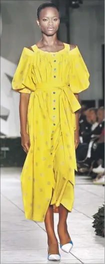  ?? Bebeto Matthews Associated Press ?? BRIGHT yellow was the color of choice for Carolina Herrera.