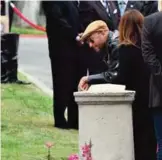  ??  ?? Musician and singer Tom Morello attends the funeral.