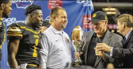  ?? CONTRIBUTE­D BY DANIEL VARNADO ?? Valdosta coach Alan Rodemaker displays the trophy after his Wildcats beat Tucker in the Class AAAAAA state title game at the Georgia Dome in 2016. Despite a 36-17 record over four years, Rodemaker was ousted by the school board.