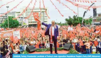  ??  ?? SAMSUN, Turkey: Presidenti­al candidate of Turkey’s main opposition Republican People’s Party (CHP) Muharrem Ince greets supporters during an election campaign rally on May 19, 2018. — AFP