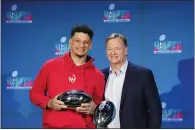  ?? ROSS D. FRANKLIN — THE ASSOCIATED PRESS ?? Chiefs quarterbac­k Patrick Mahomes, left, holds up the Super Bowl MVP Trophy as he stands next to NFL Commission­er Roger Goodell during a Super Bowl news conference in Phoenix on Monday.