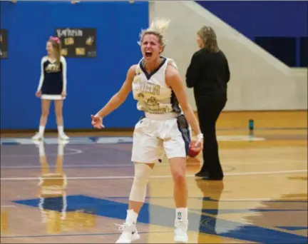  ?? BARRY BOOHER — FOR THE NEWS-HERALD ?? John Carroll’s Kahrin Spear celebrates during the Blue Streaks’ victory over Otterbein on Feb. 13.