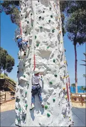  ??  ?? JUST TRY to keep the younger set away from the 32-foot-high climbing wall at Descanso Beach Club.