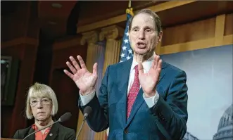  ?? J. SCOTT APPLEWHITE / AP 2018 ?? Ron Wyden (with fellow Oregon Democratic U.S. Sen. Patty Murray) has proposed legislatio­n that would allow states to establish legal marijuana markets without the fear of federal criminal interventi­on. “The federal prohibitio­n of marijuana is wrong, plain and simple,” he said Friday.