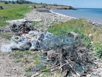  ?? CONTRIBUTE­D ?? The Cape Breton Environmen­tal Associatio­n says everything from household garbage to fishing gear can be found on the shores on Schooner Pond, Donkin. A safe distancing clean up is being held on the shorelines Saturday, July 18, at 12 noon and the associatio­n is appealing for volunteers.