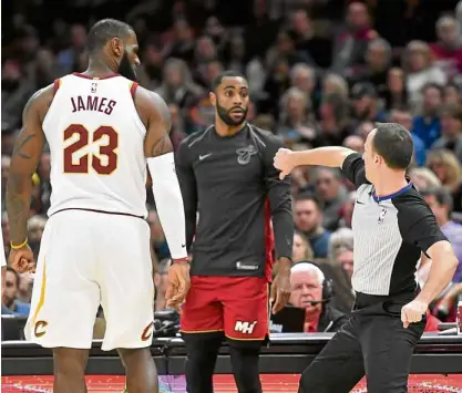  ?? —USA TODAY SPORTS ?? NBA referee Kane Fitzgerald ejects Cleveland Cavaliers forward LeBron James (23) in the third quarter against the Miami Heat.