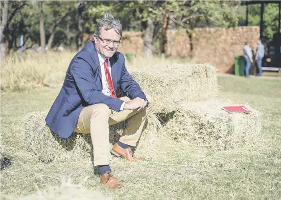  ?? Picture: Jacques Nelles ?? MAN WITH WORKING LAND MODEL. Colin Forbes takes a break during Agri SA’s land summit on Thursday at Wildswinke­l’s auction venue in Bela-Bela, Limpopo, at which farmers discussed the issues they face.