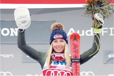  ?? Agence France-presse ?? ↑
Mikaela Shiffrin of the US celebrates on the podium after winning the women’s alpine World Cup slalom at Killington on Sunday.