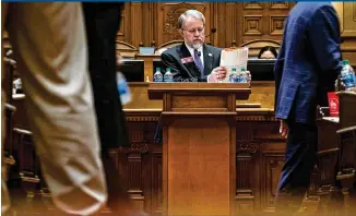  ?? CONTRIBUTE­D BY BEN@BENGRAY.COM ?? Rep. Terry England, R-Auburn, chair of the House Appropriat­ions Committee, goes over the state budget in the House chamber Tuesday morning. The House passed a $28 billion state budget that included cuts to programs that lawmakers from both parties decried.