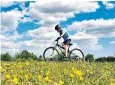  ??  ?? Cycling in a meadow near Ashford, Kent