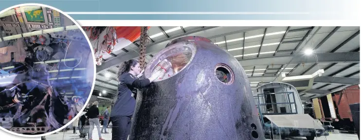  ??  ?? Claire Madley from the National Railway Museum Shildon inspects the Soyuz TMA-19M spacecraft